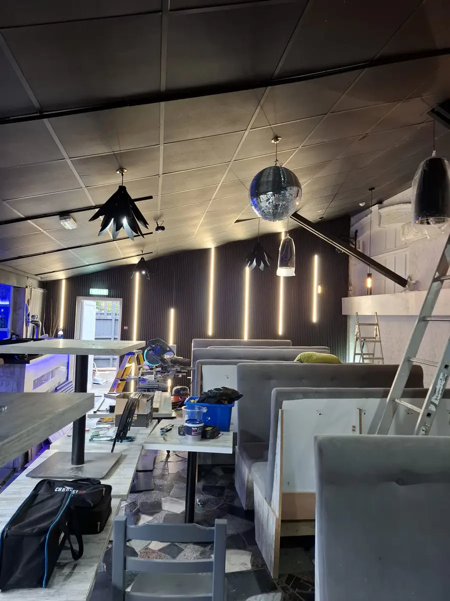 Venue Refurbishment with Vertical Tube LEDs on Acoustic Wood Slat Paneling